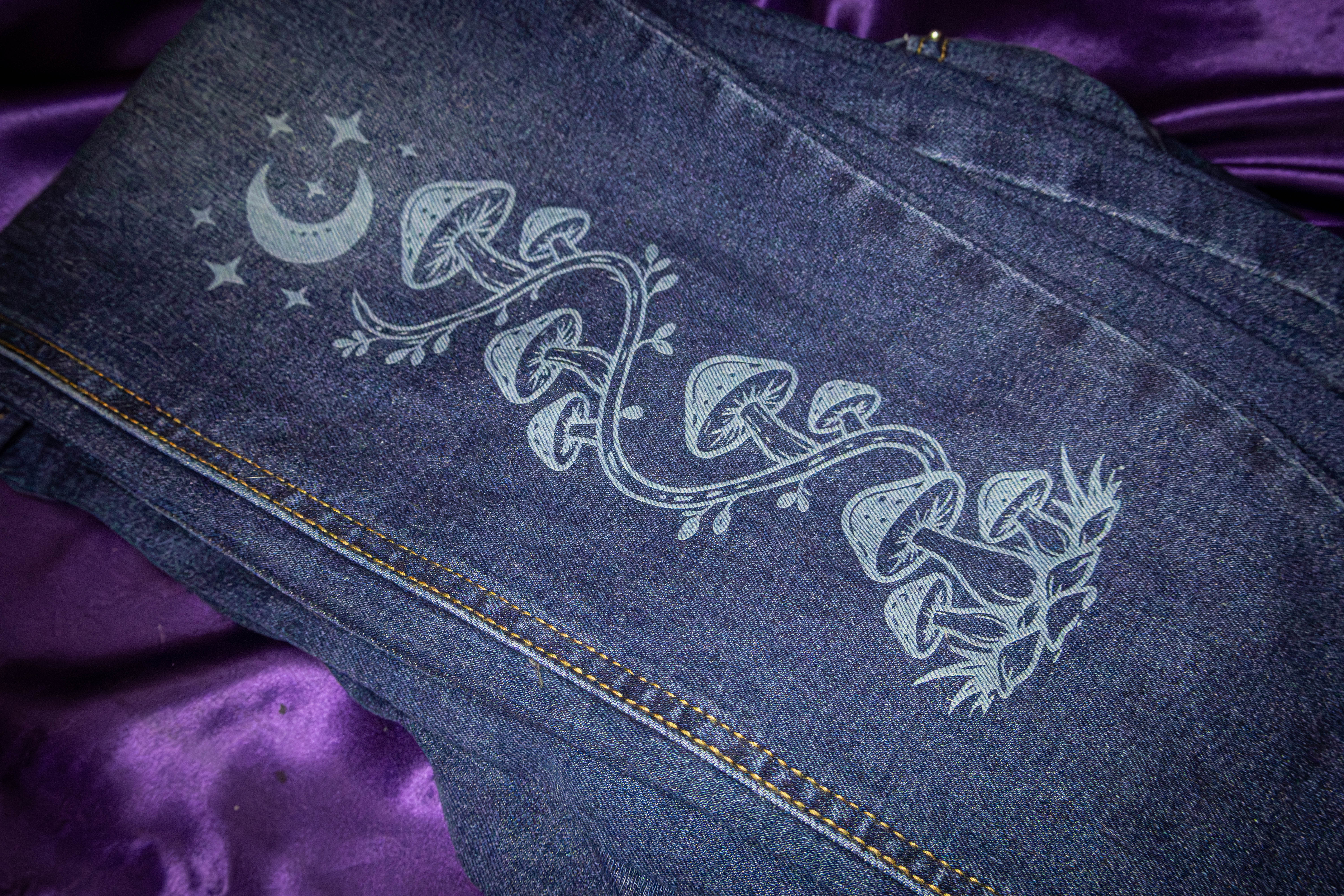 Laser-engraved mushroom design on denim by Neurospice Design Shop